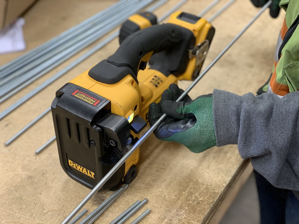 yellow and black cordless hand drill
