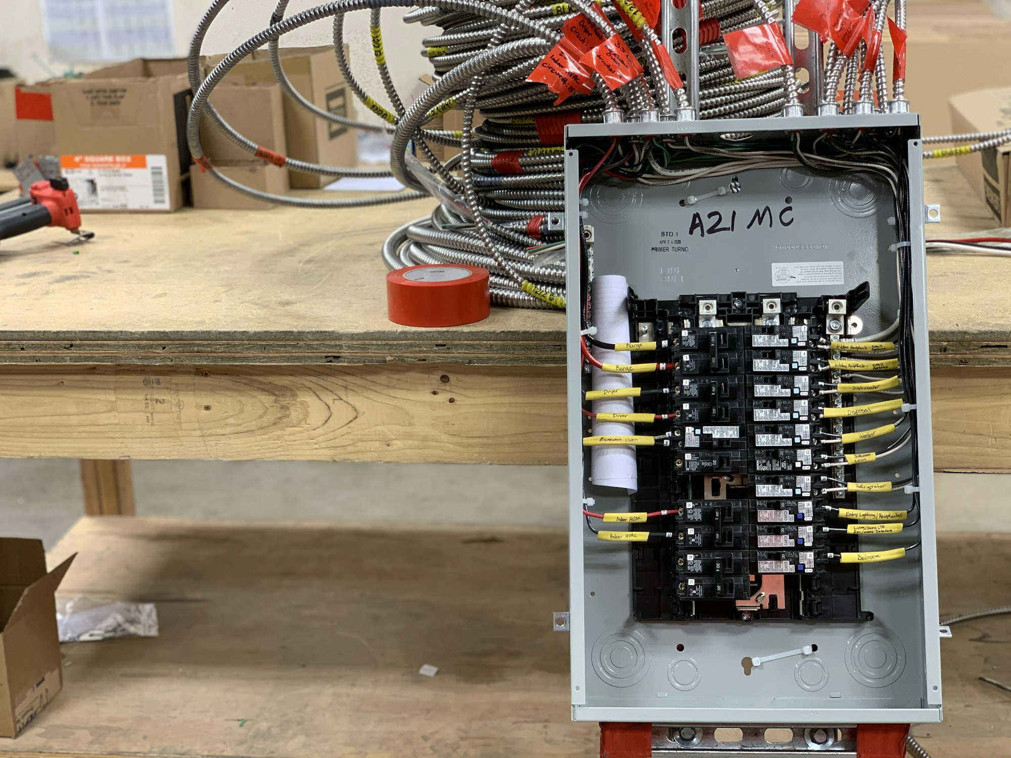 Electrical panel with wires and breakers during a home renovation