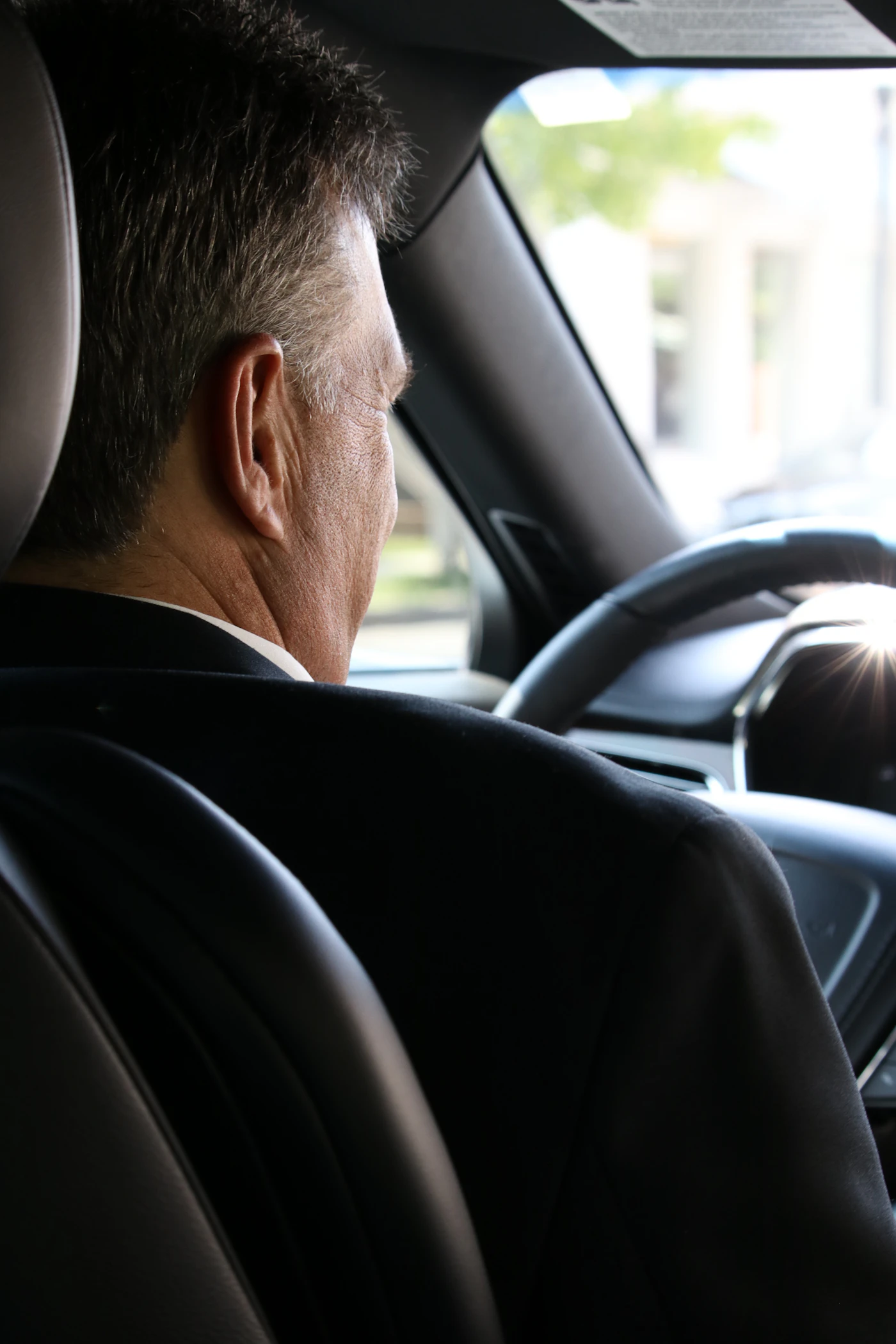 Professional driver seated in a vehicle
