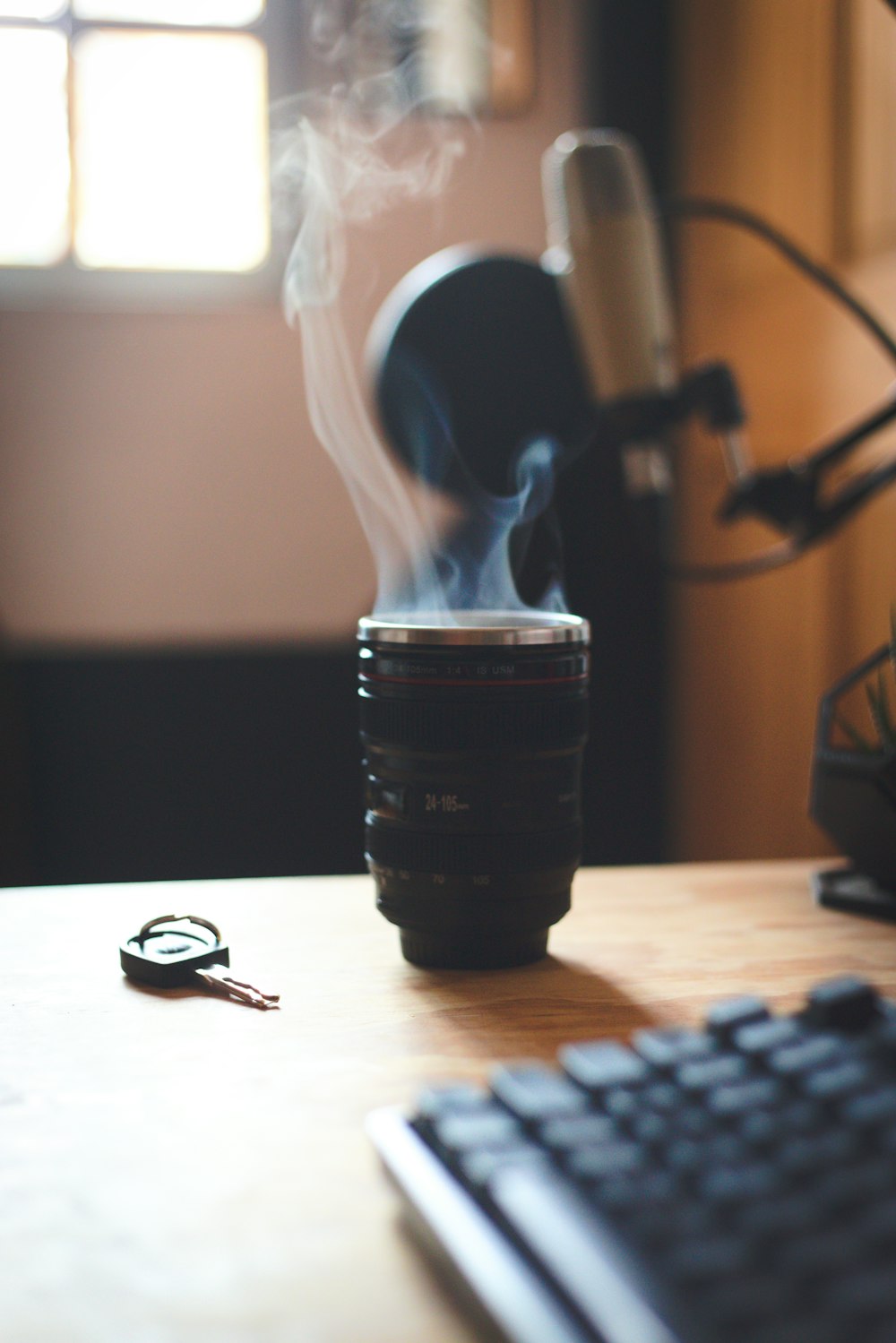 black camera lens on brown wooden table