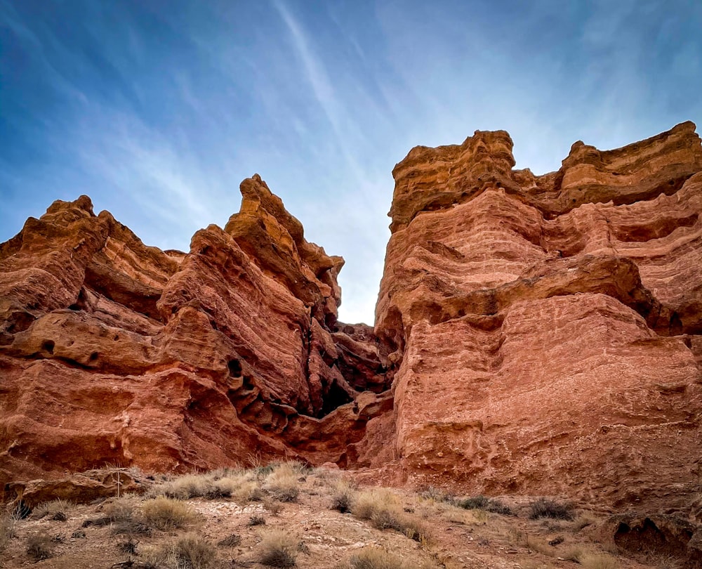 brown rock formation under blue sky during daytime