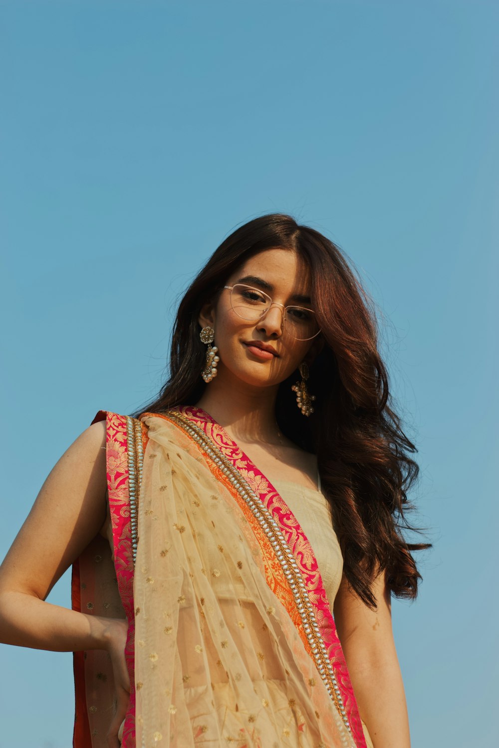 woman in pink and beige sari
