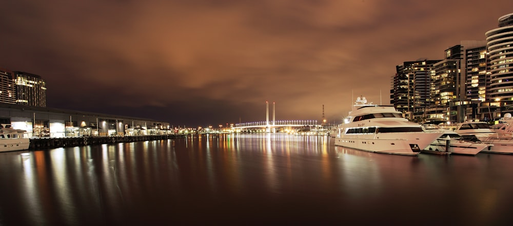 white boat on water during night time