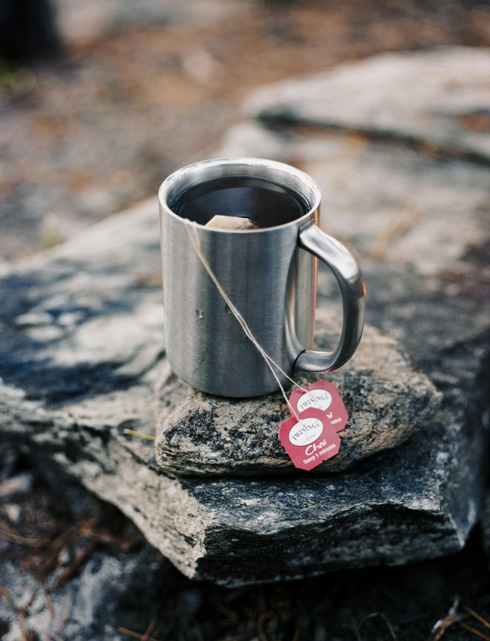 red heart shaped ornament on gray metal mug