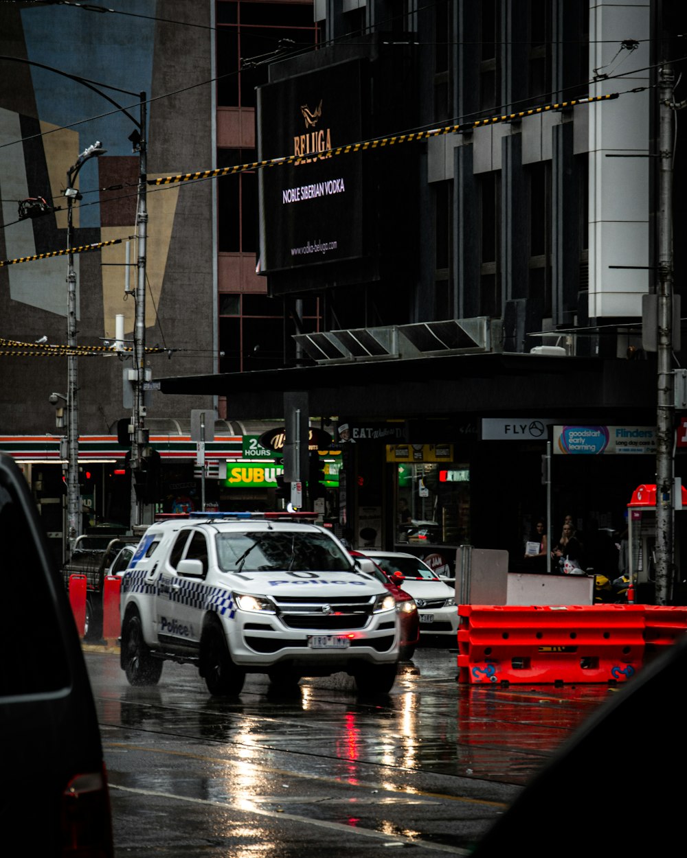 cars on road near building during daytime