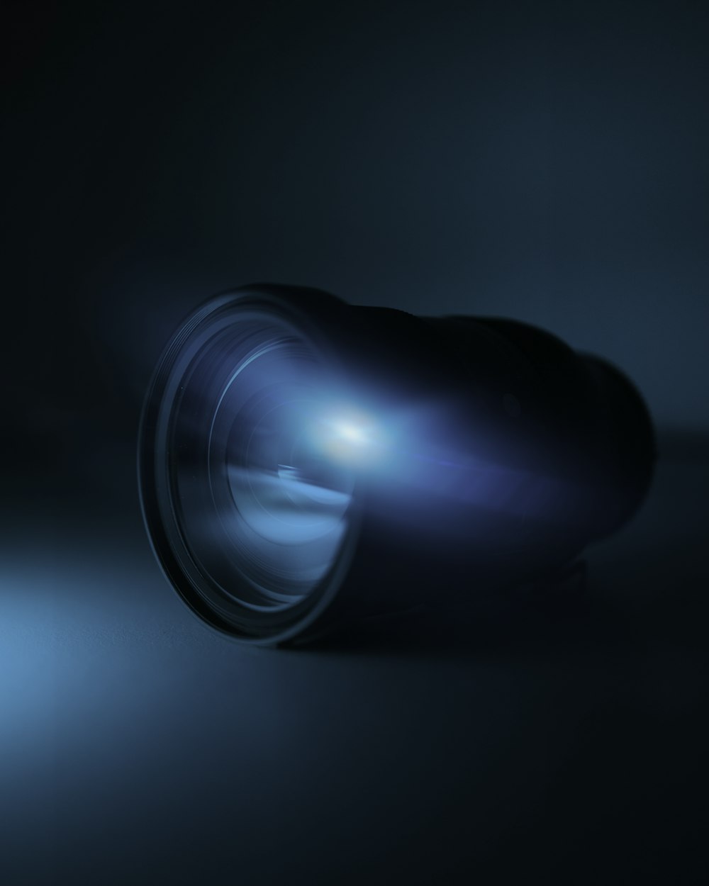 blue light bulb turned on in dark room photo – Free Blue Image on Unsplash