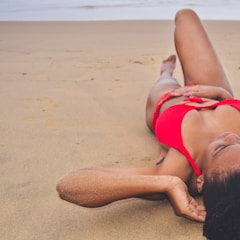 A person enjoying the beach wearing a comfortable, stylish swimsuit by the ocean