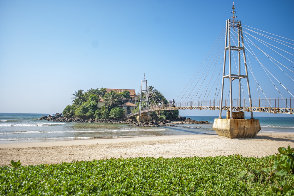 brown wooden bridge over the sea during daytime