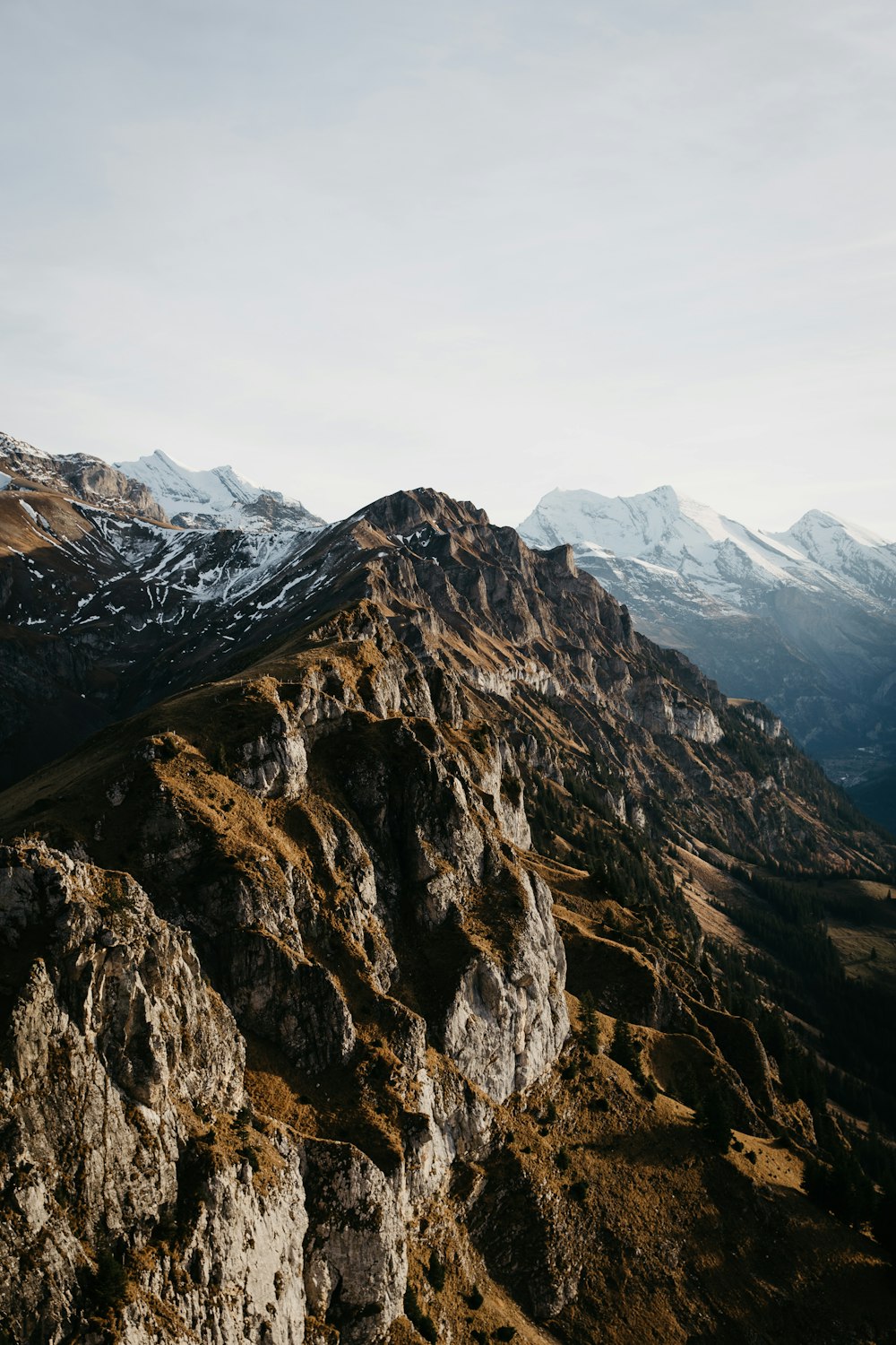 brown rocky mountain under white sky during daytime