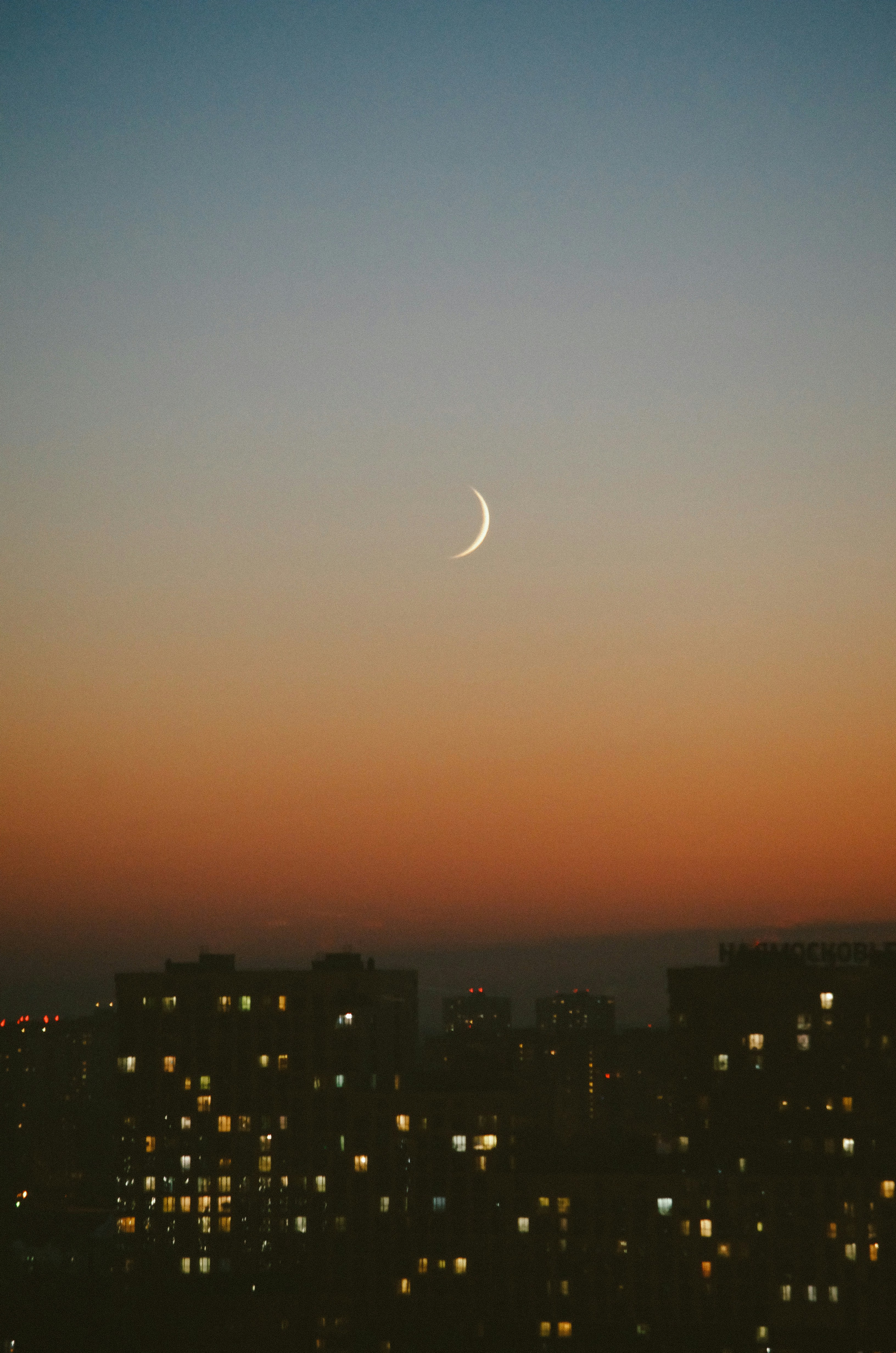 city skyline under orange sky