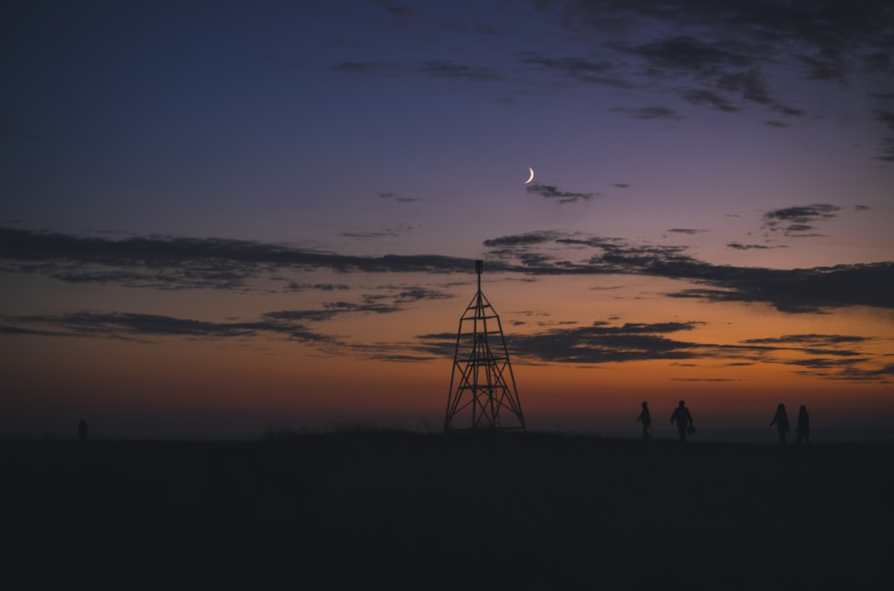 silhouette of people on beach during sunset