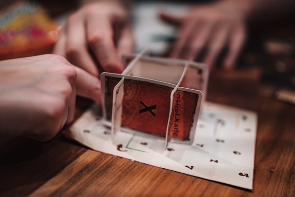 Close-up of hands playing with an educational puzzle game