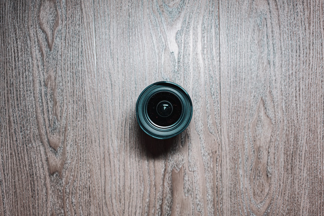 black round device on brown wooden table