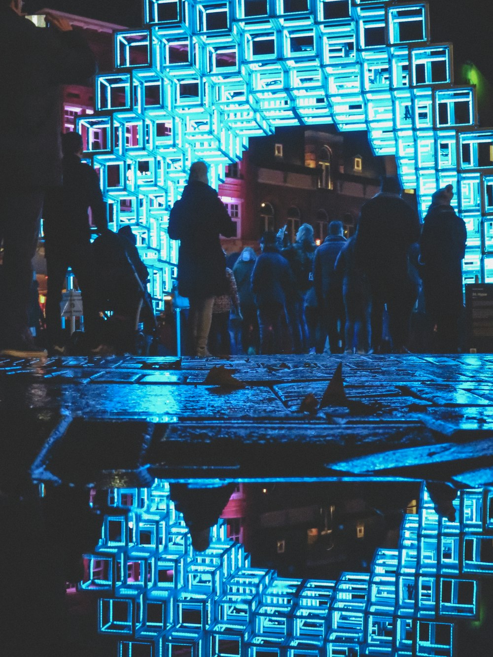 people walking on street during night time