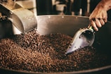black and white ceramic fish figurine on black and brown coffee beans