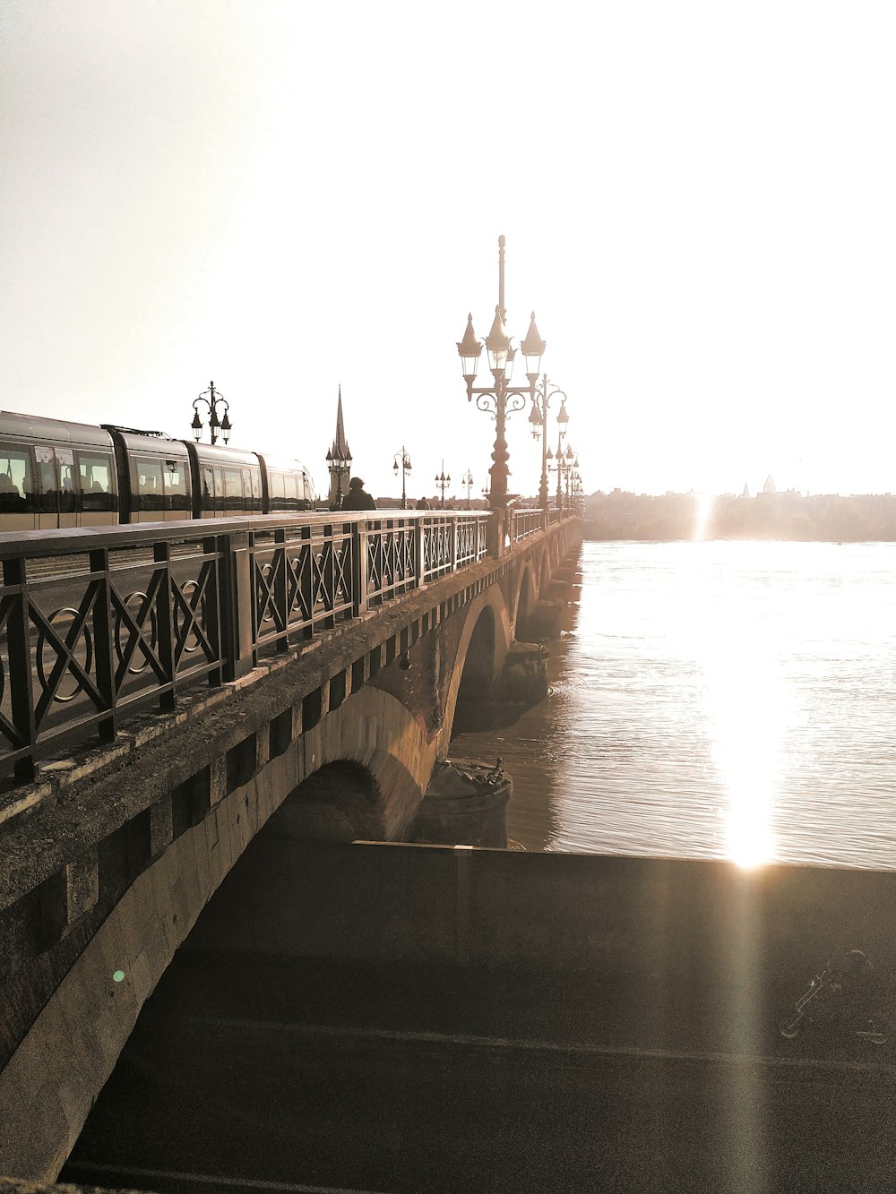 gray concrete bridge over body of water