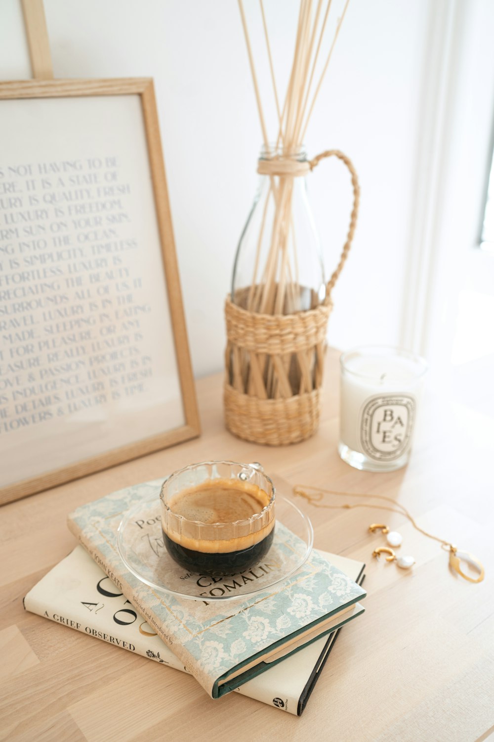 clear glass cup on white and brown floral table cloth