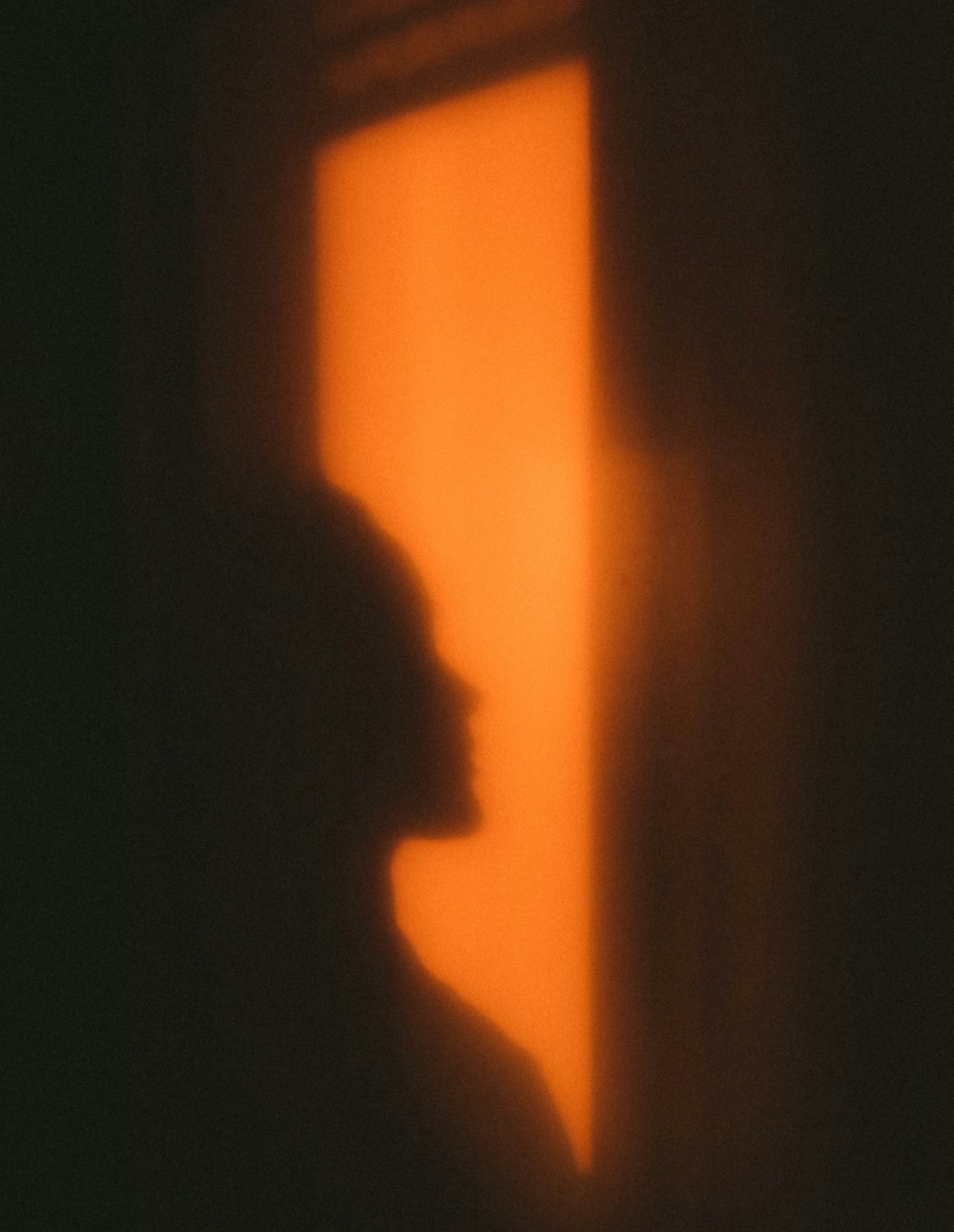 silhouette of person on orange background