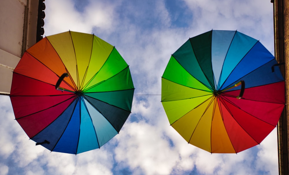 red umbrella under blue sky