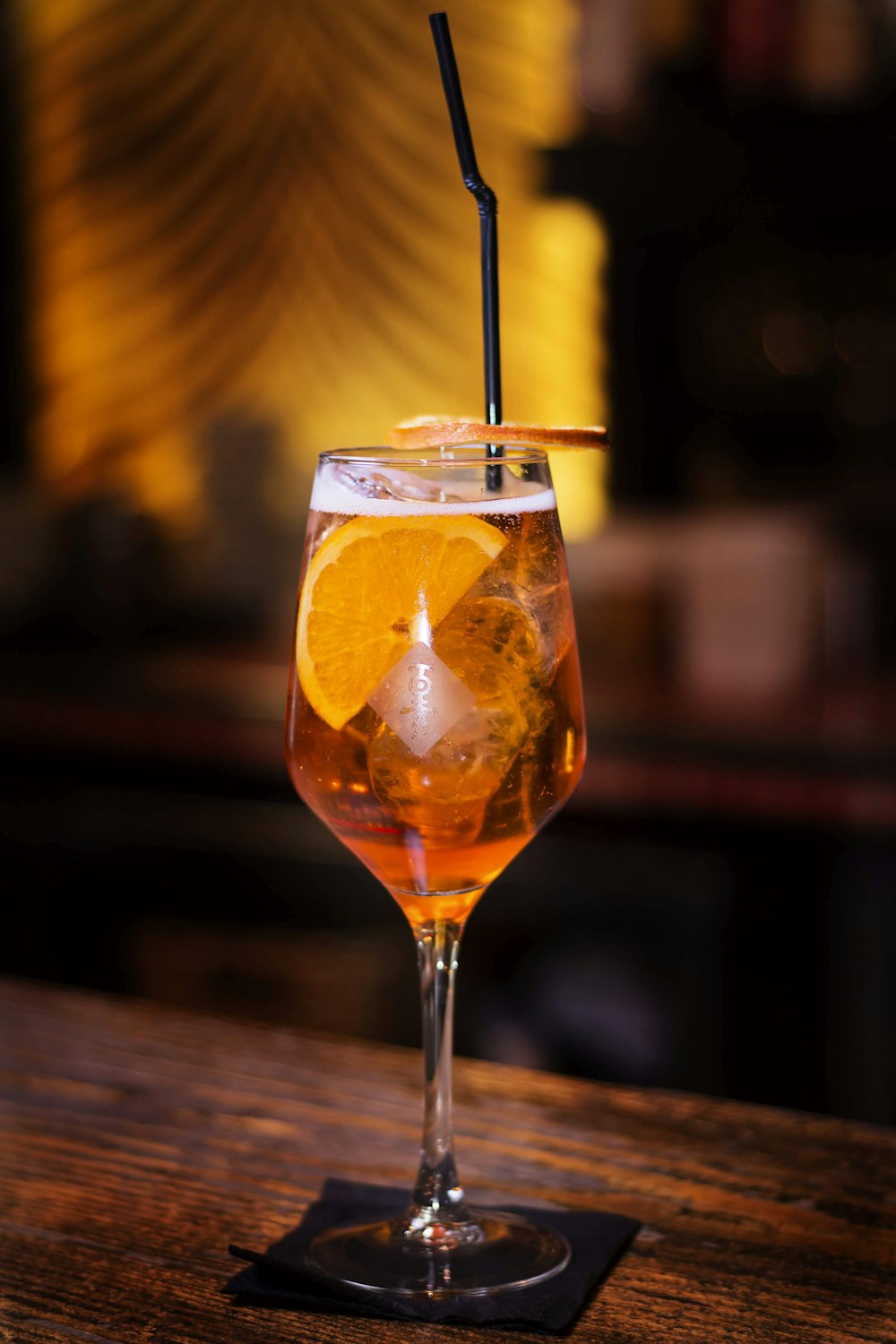 clear wine glass with orange liquid