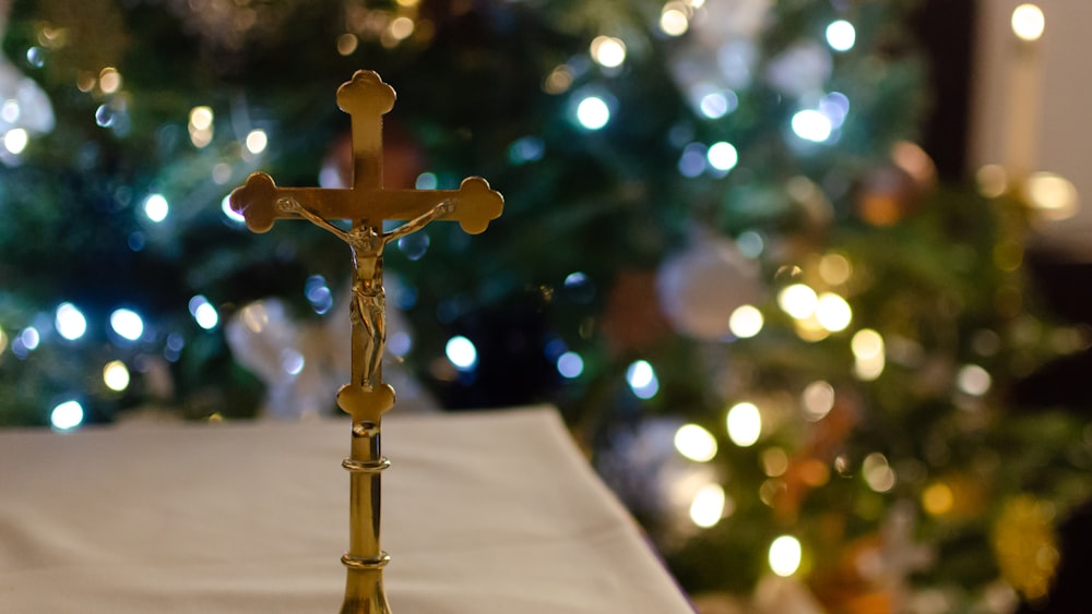 gold cross on white textile