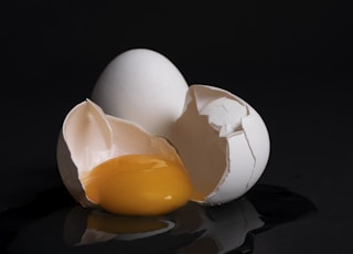 white egg on brown wooden tray