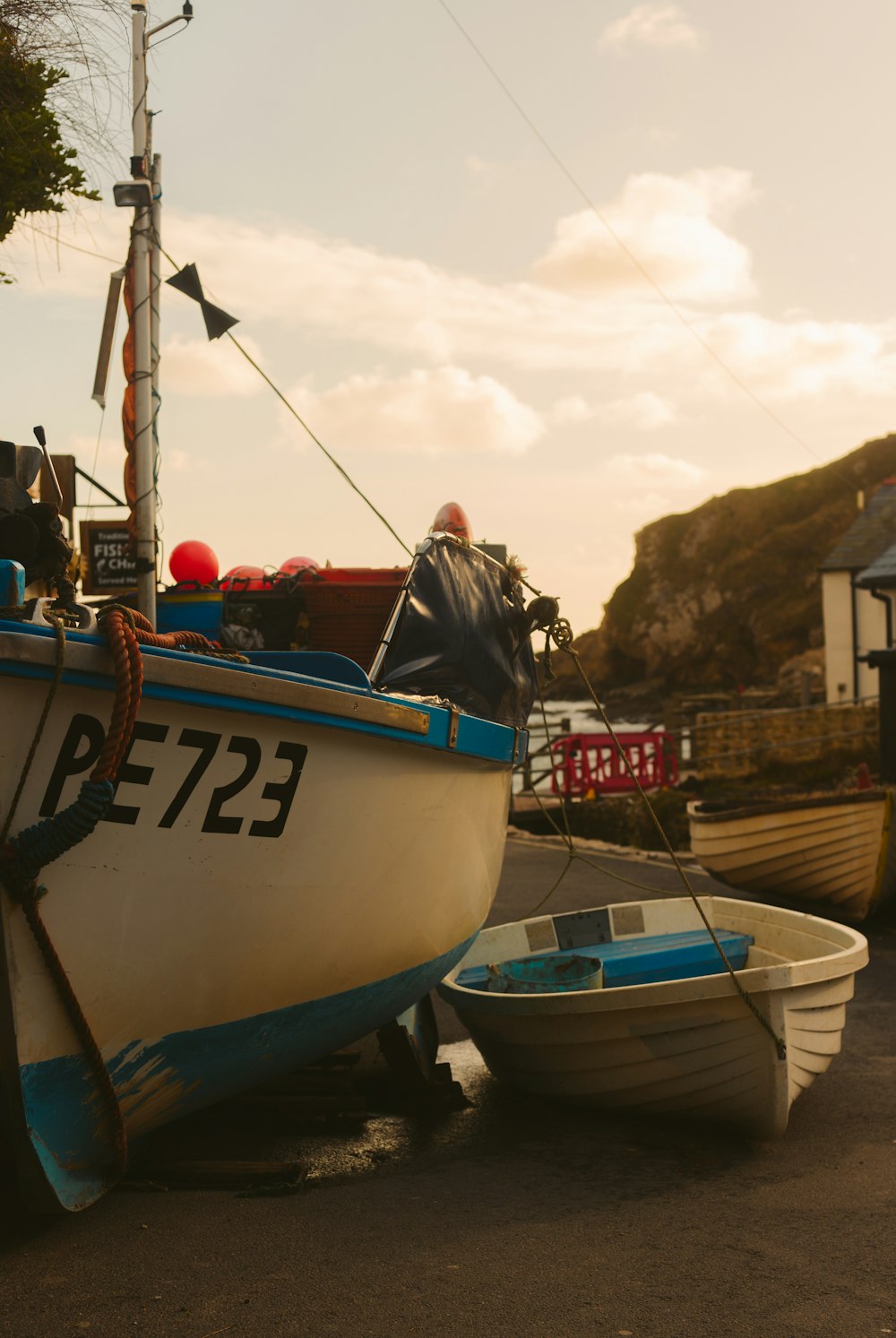 blue and white boat on dock during daytime