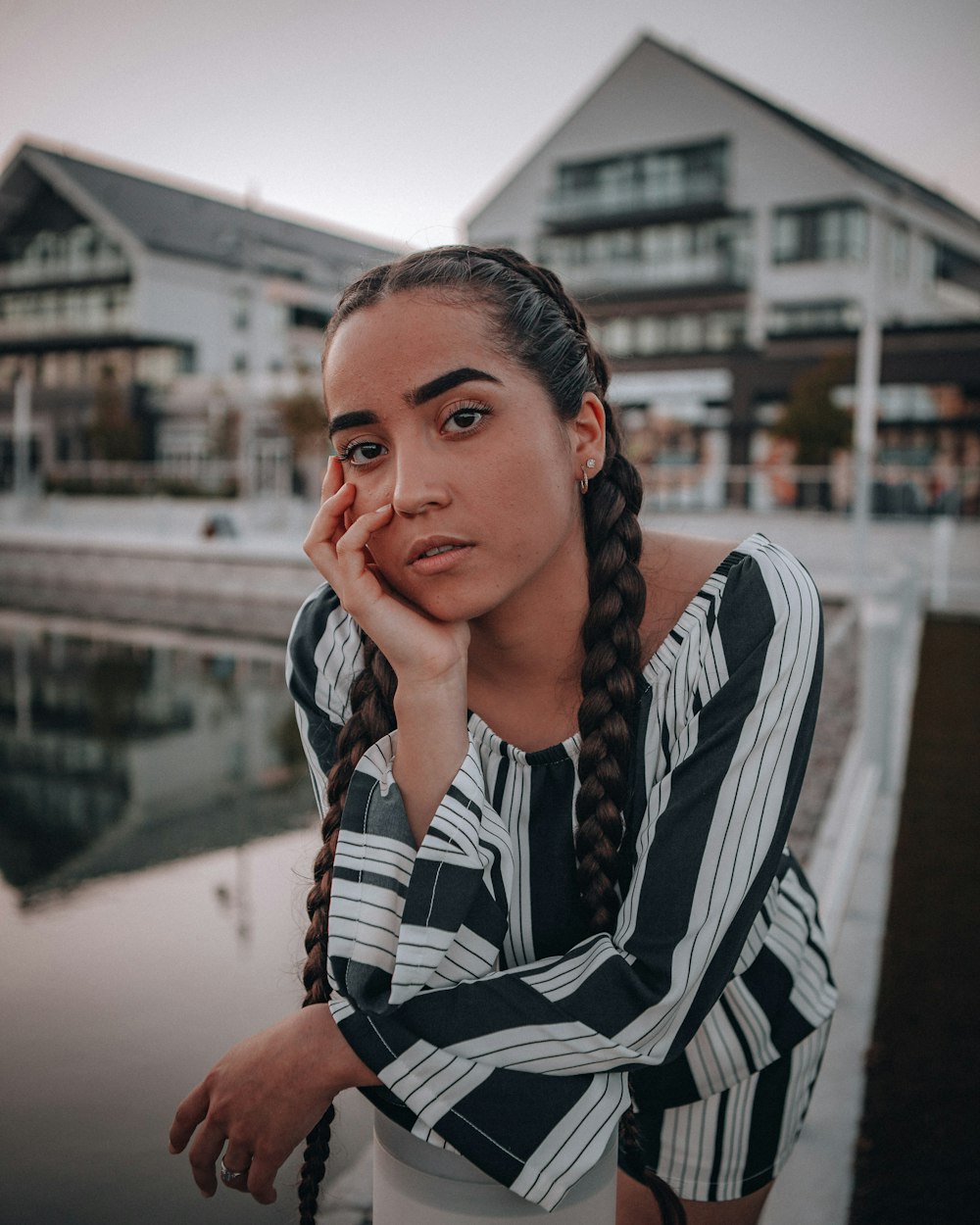 woman in black and white striped long sleeve shirt