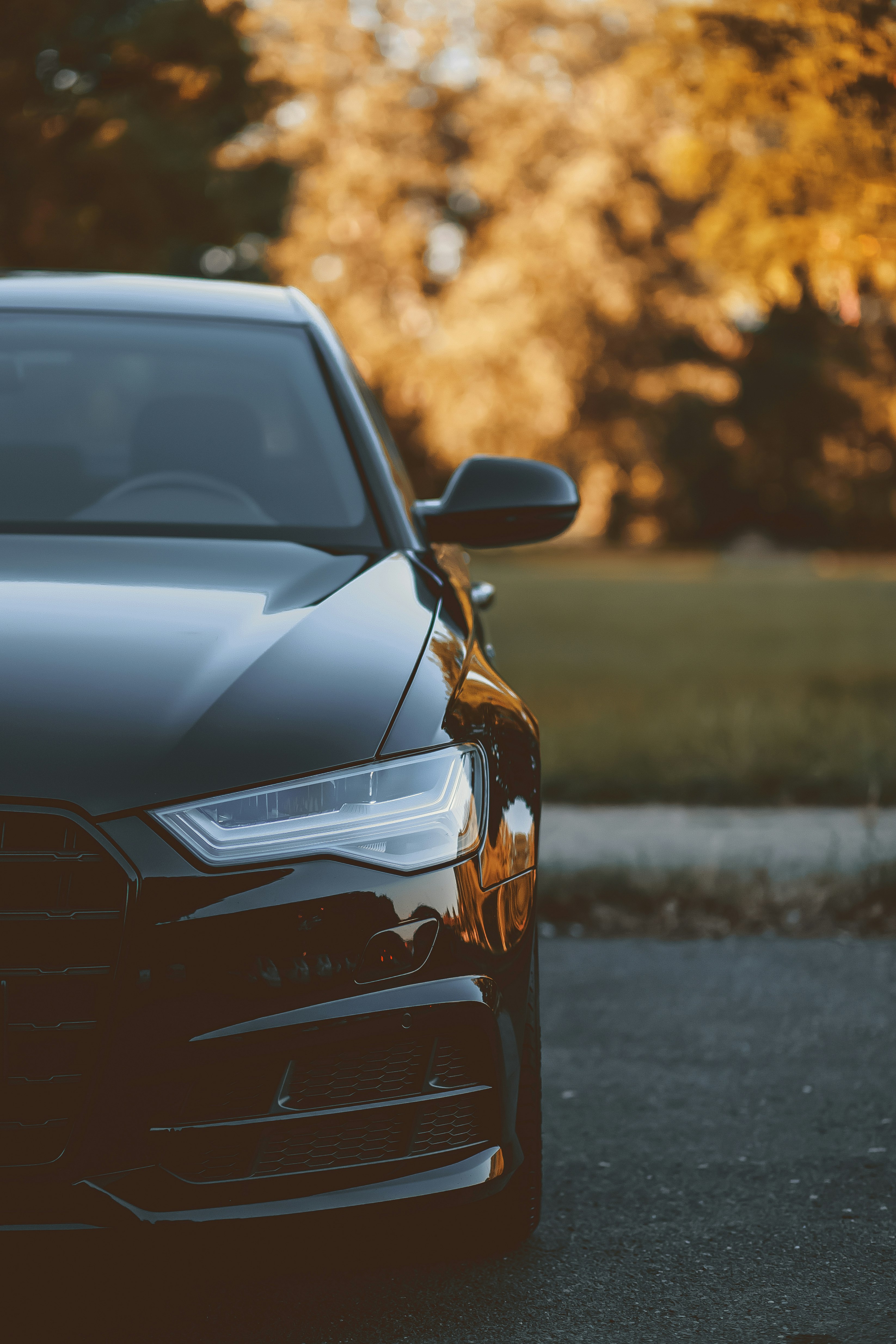 black and brown car on gray asphalt road during daytime