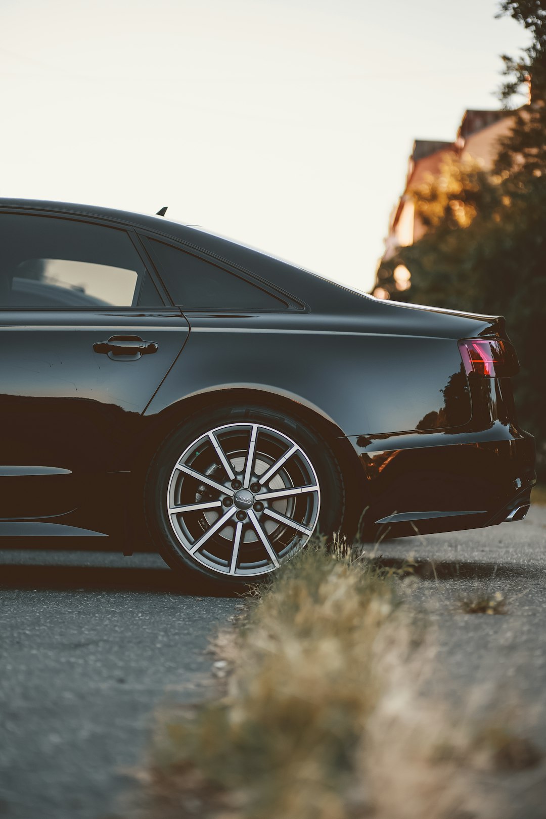 black car on brown grass field during daytime