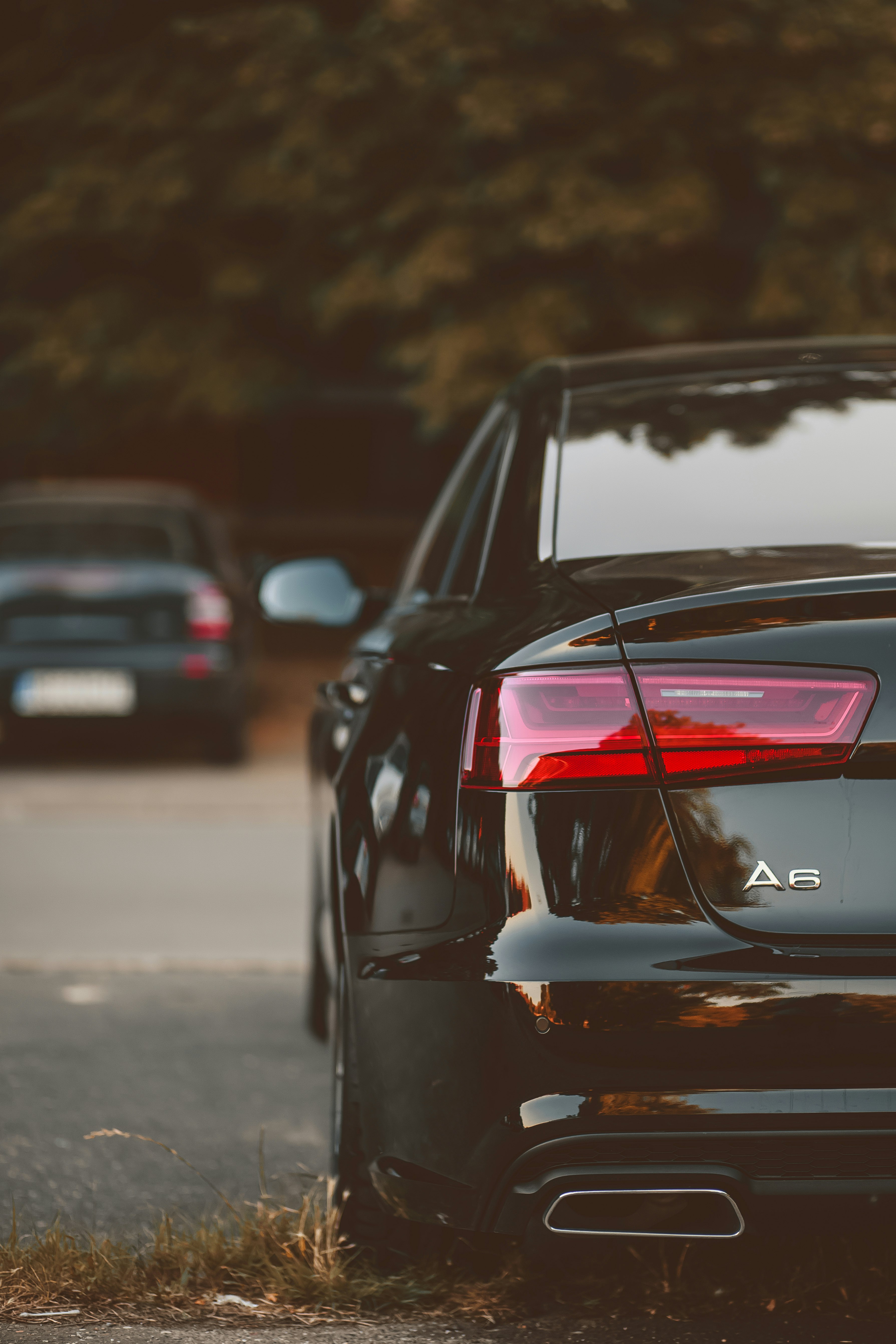 black car on road during night time