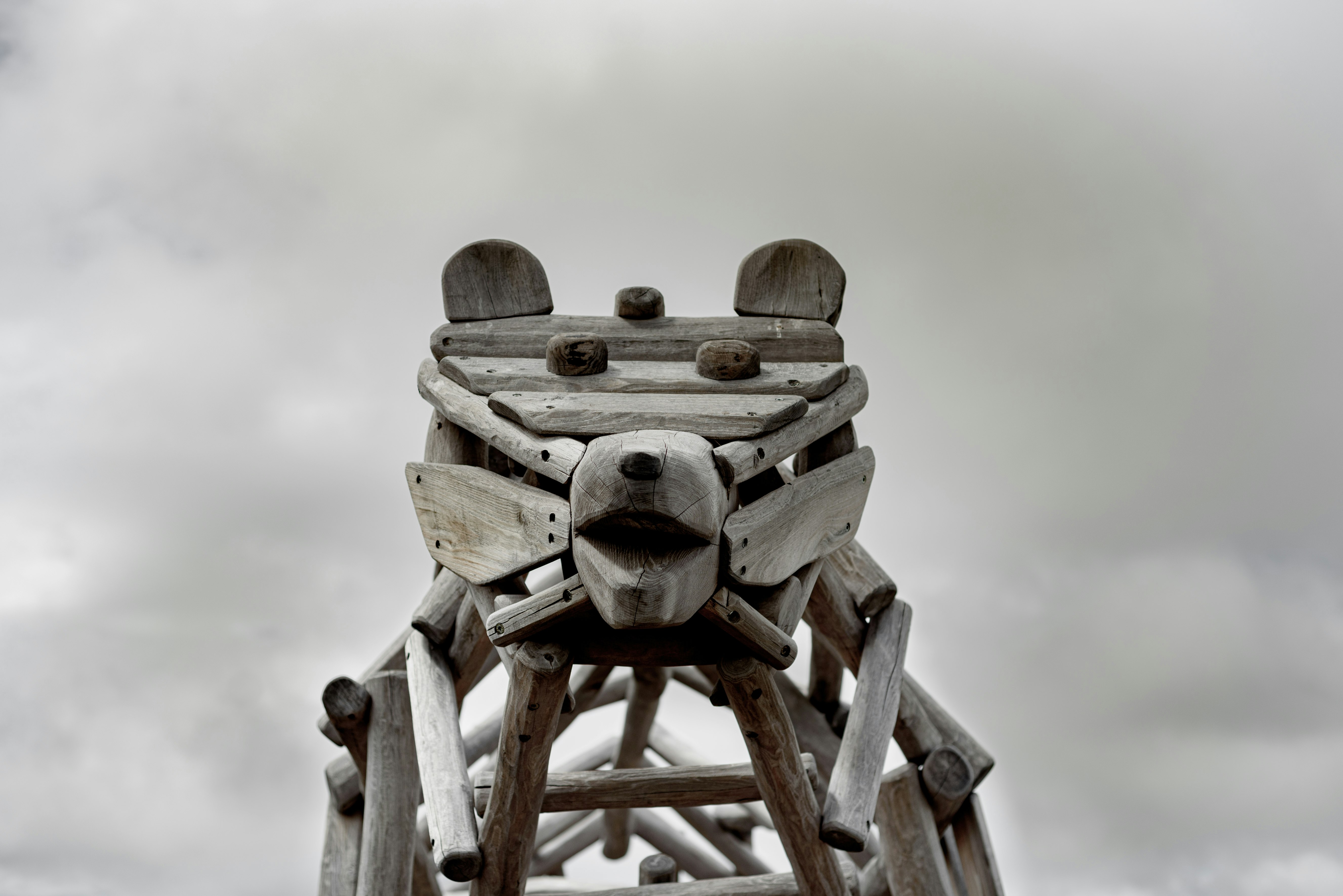 brown wooden robot on brown wooden ladder