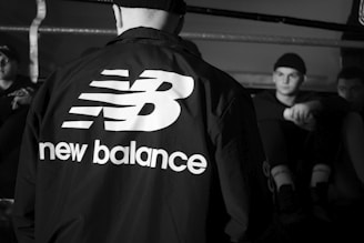 man in black and white adidas jacket