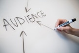 person writing on white paper