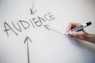 person writing on white paper