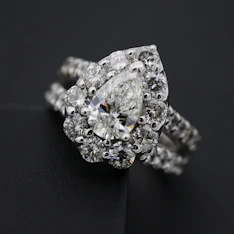 silver diamond studded ring on black textile