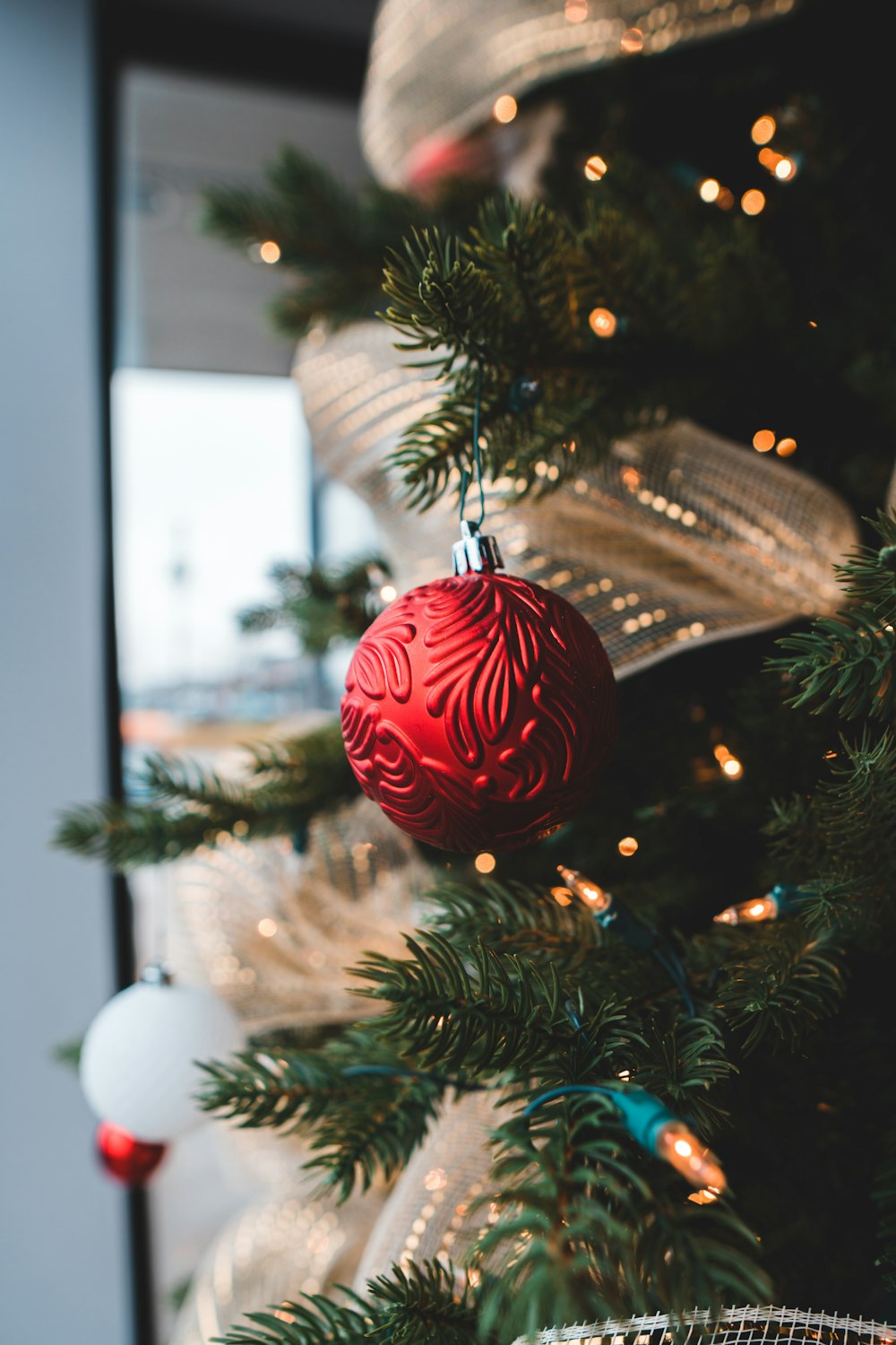 red baubles on green christmas tree