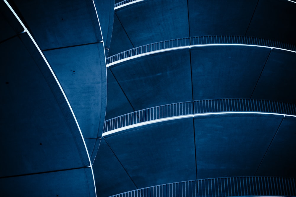 blue spiral stairs with blue metal railings