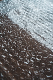 white and red textile on brown surface