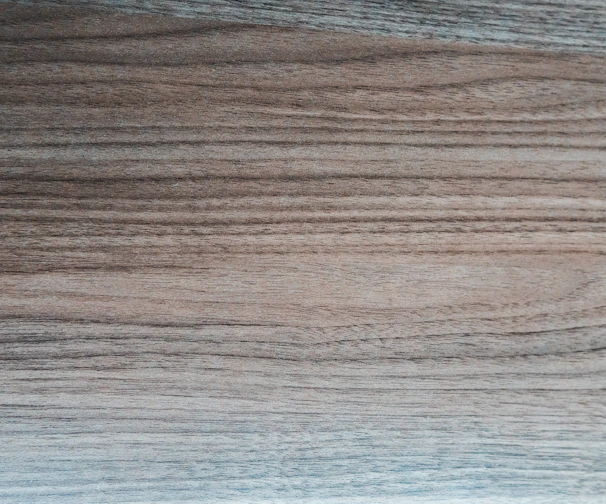 Close-up of rich oak timber panels showcasing natural grain and warm brown hues.