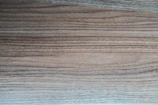 Close-up of oak wood grain showing natural light brown tones.