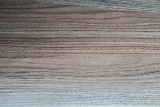 Close-up of rich oak timber panels showcasing natural grain and warm brown hues.