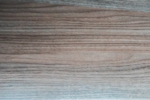 Close-up of rich, textured plywood grain highlighting natural wood tones.