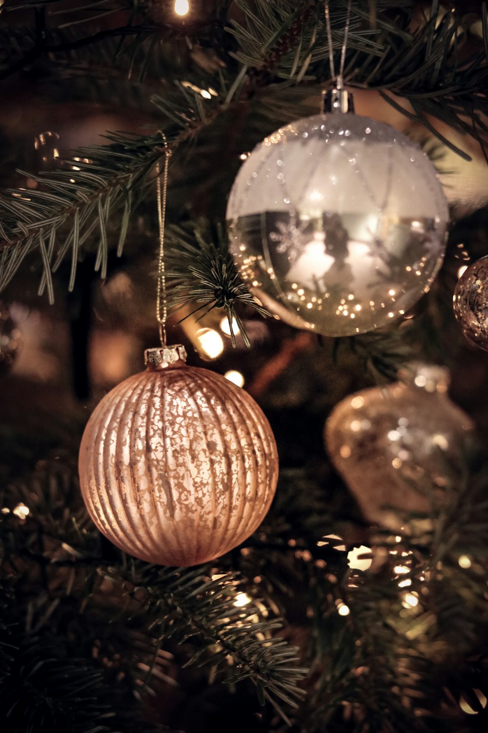 gold bauble on christmas tree