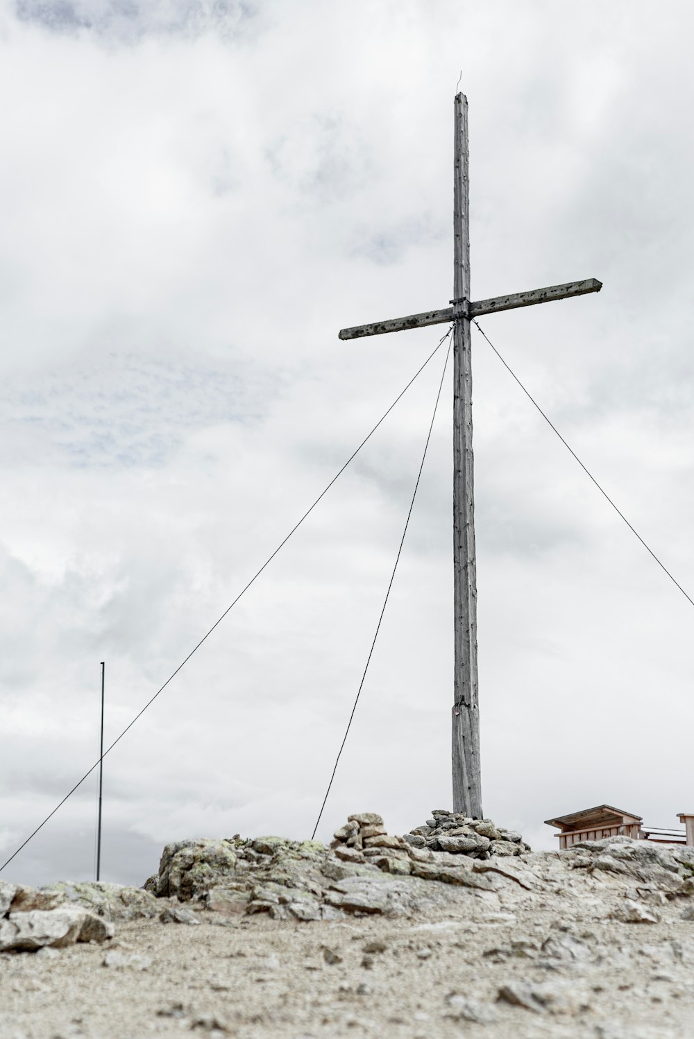 gray windmill under cloudy sky during daytime