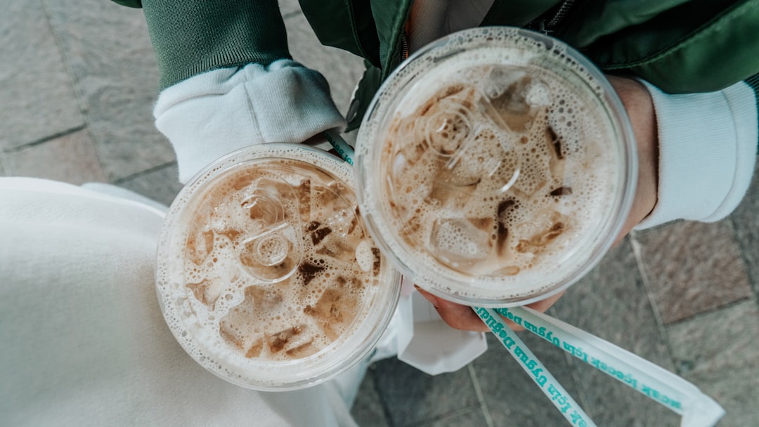 white plastic cup with brown liquid