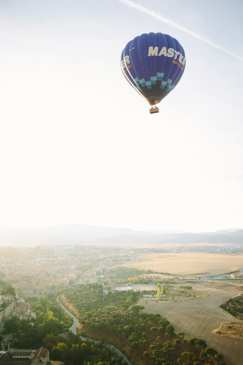 blue and white hot air balloon in the sky during daytime