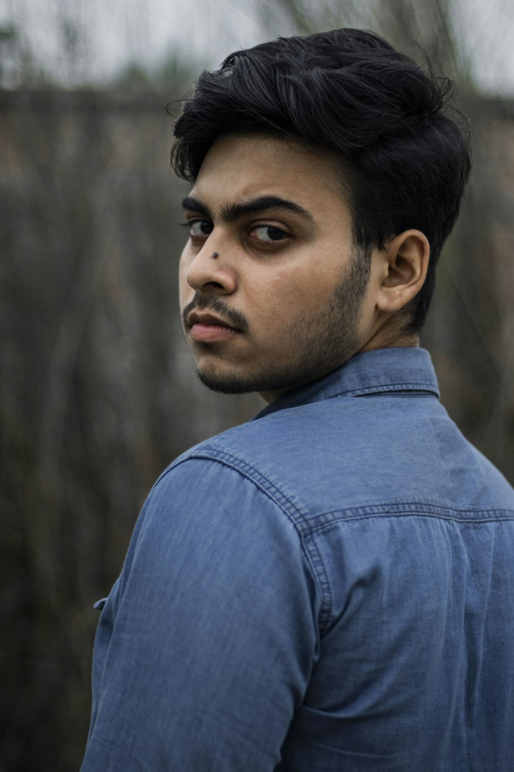 man in blue denim jacket