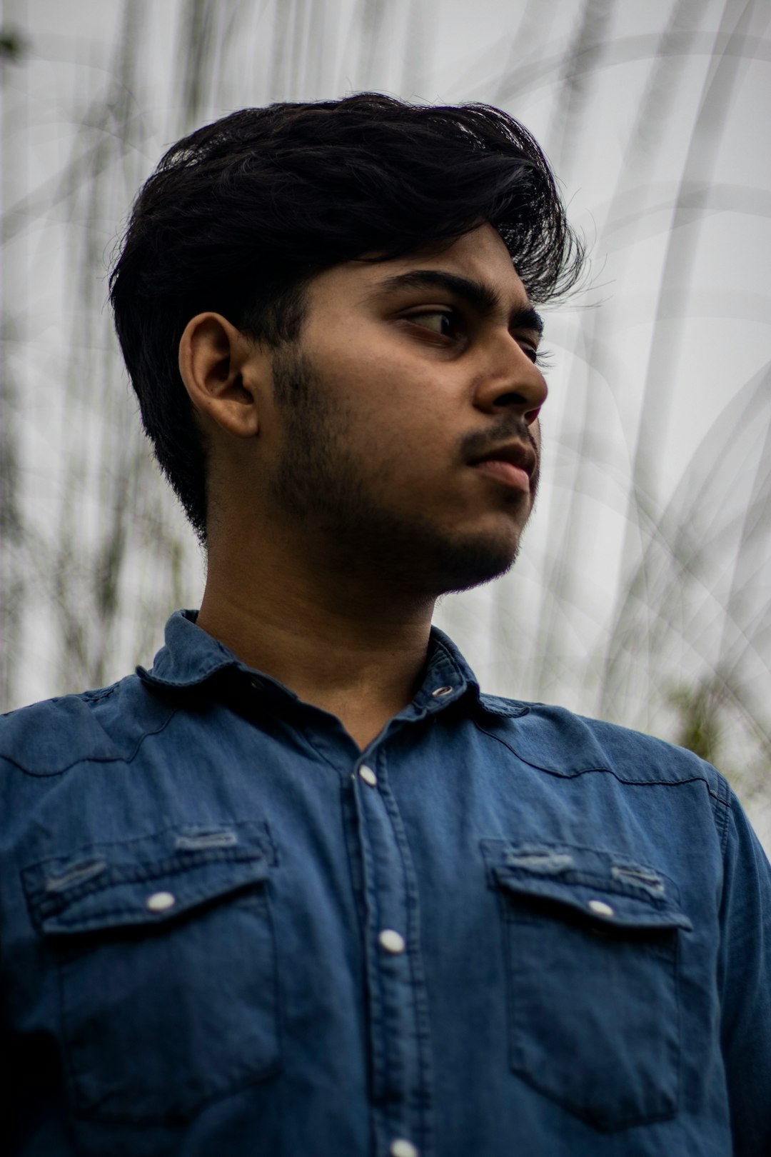 man in blue denim button up shirt