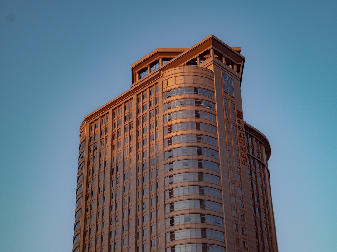 brown concrete building under blue sky during daytime